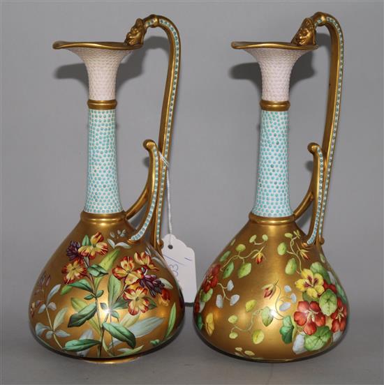 A pair of Copeland gilt and floral decanted ewer style vases